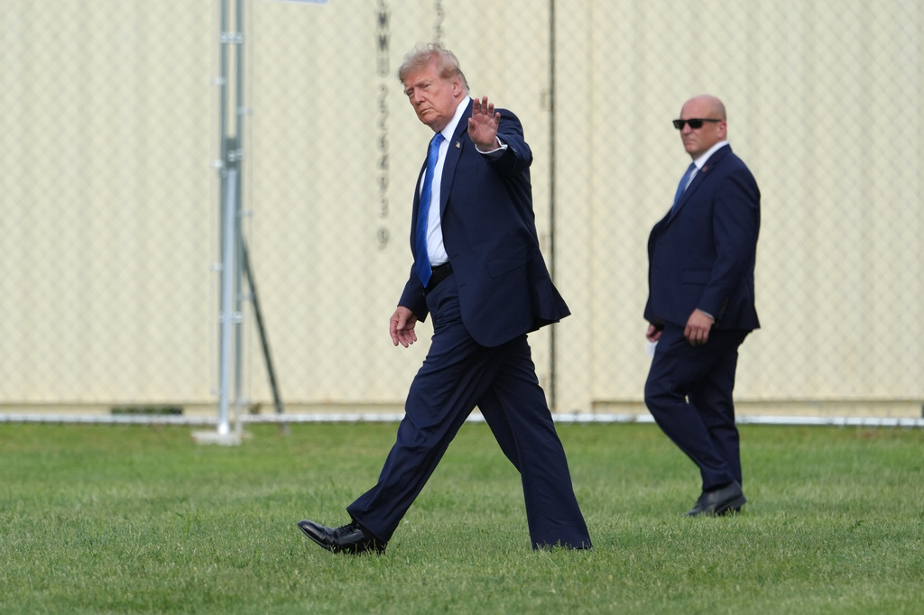 President Donald Trump walks to board his presidential limousine after arriving on Marine One from the Ellipse near the White House, Friday, Aug. 28, 2026, in Washington, on return from Houston. (AP Photo/Jacquelyn Martin)