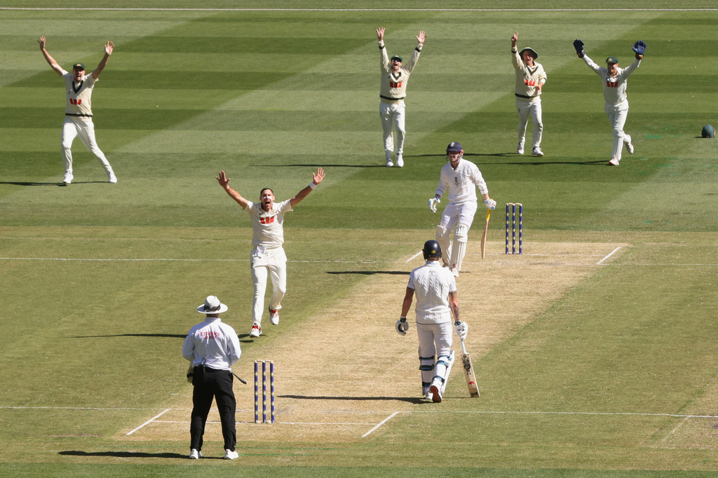 Australia's Scott Boland, second left, along with teammates, successfully appeal for a LBW decision on England's Harry Brook, third right, during their Ashes cricket test match in Melbourne, Friday, Dec. 26, 2025. (AP Photo/Hamish Blair)