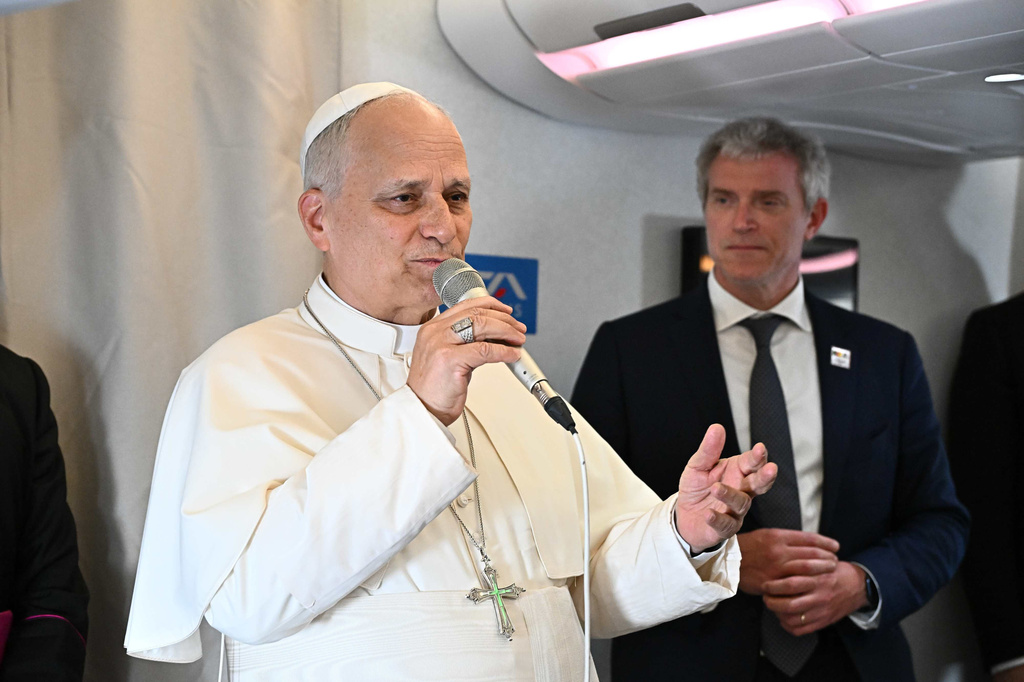 Pope Leo XIV answers journalists' questions during his flight from Yaounde, Cameroon to Luanda, Angola, Saturday, April 18, 2026. (Luca Zennaro/Pool Photo via AP)