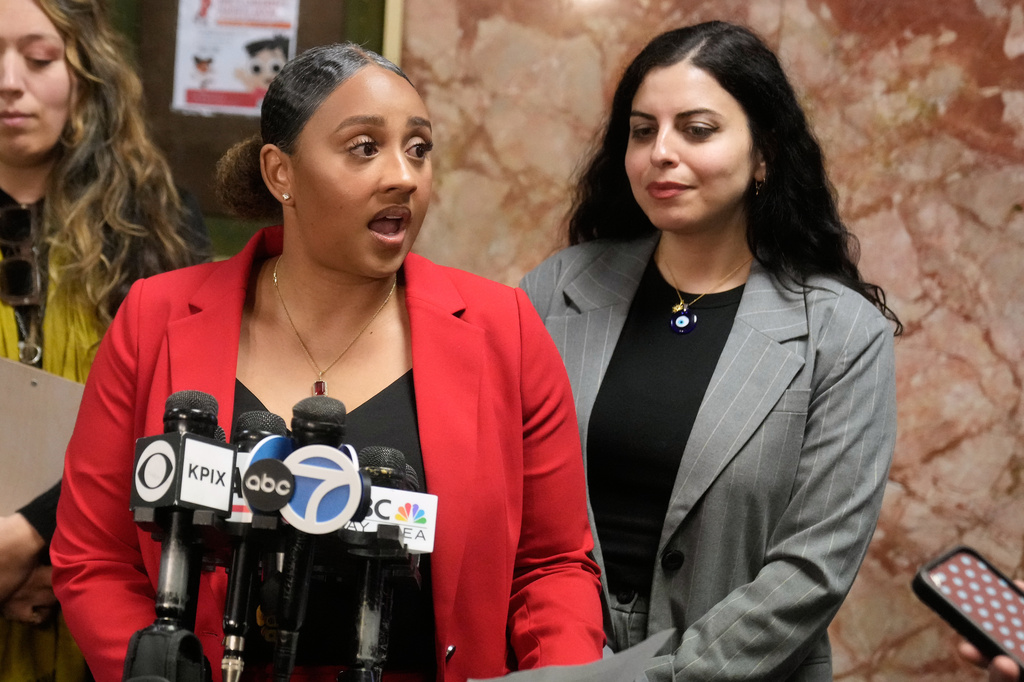 Public defenders Diamond Ward, foreground left, and Nuha Abusamra, right, representing, Daniel Moreno-Gama, speak to reporters outside of a courtroom on Tuesday, April 14, 2026, in San Francisco. (AP Photo/Jeff Chiu)