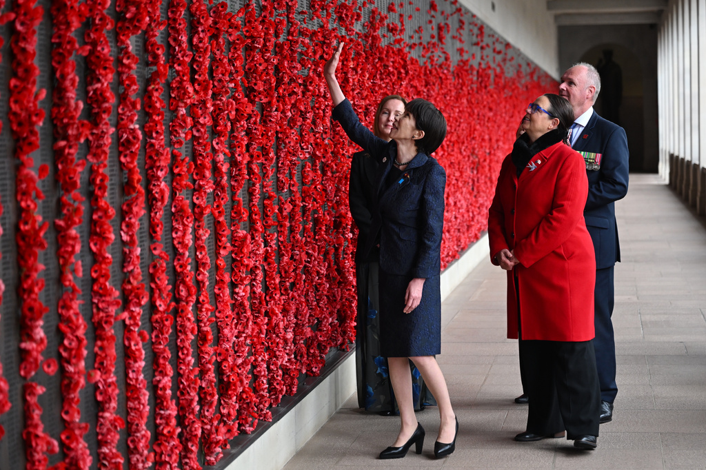 Japan's Prime Minister Sanae Takaichi, secind left, walks along the Roll of Honour during a visit to the Australian War Memorial in Canberra, Australia, Monday, May 4, 2026. (Lukas Coch/AAP Image via AP)