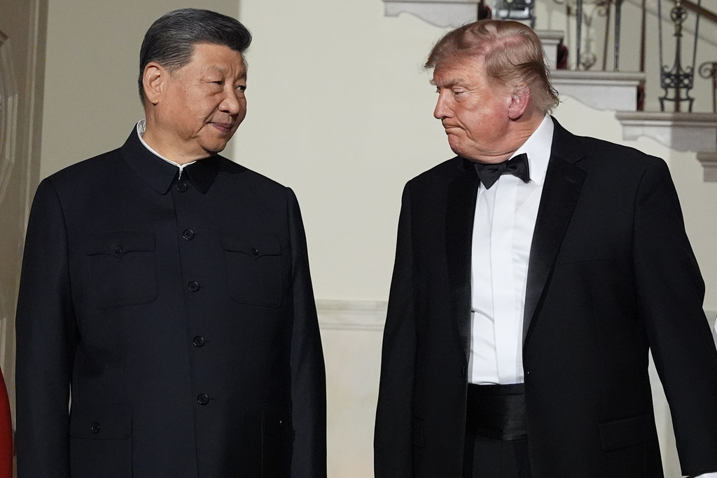 President Donald Trump and China's President Xi Jinping walk in the Grand Foyer of the White House during a State Dinner, Thursday, Sept. 24, 2026, in Washington. (AP Photo/Alex Brandon)