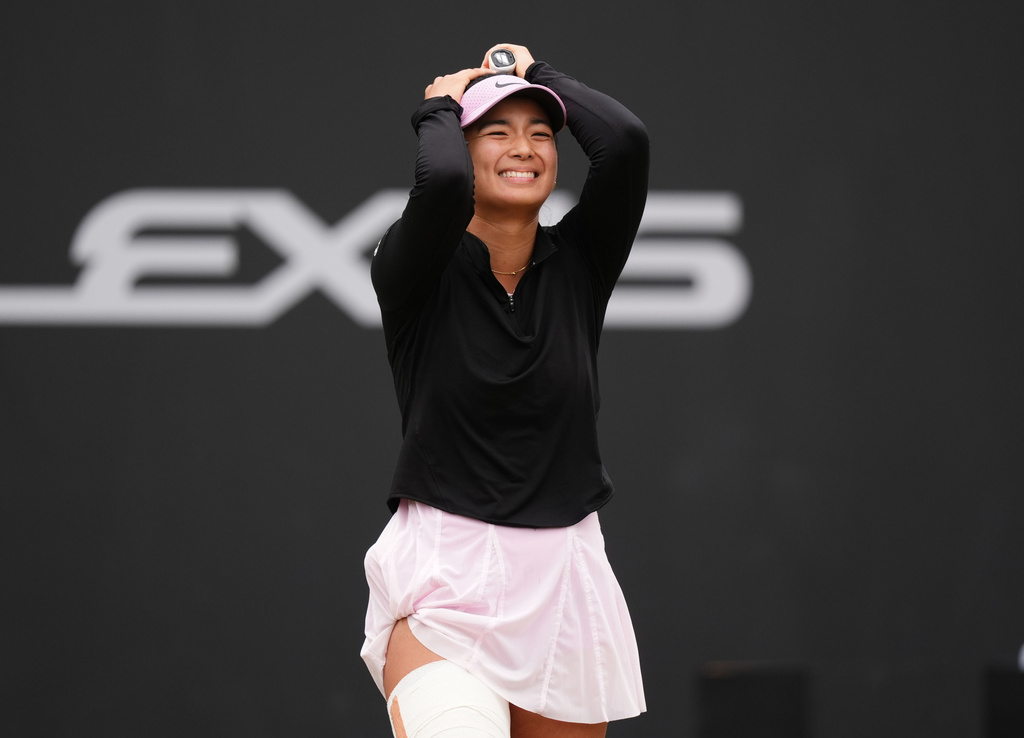 Philippines' Alexandra Eala celebrates winning her women's singles final match against Nikola Bartunkova on day nine of the Lexus Birmingham Open Championships at Edgbaston Priory Club, Birmingham, England, Sunday June 7, 2026. (Mike Egerton/PA via AP)