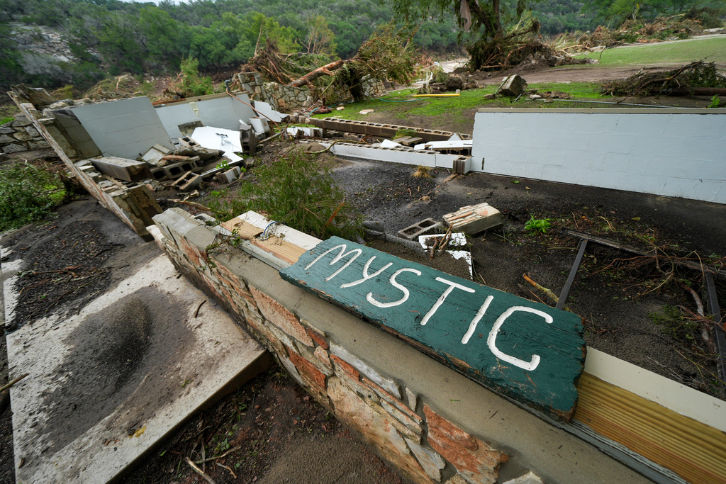 FILE - A Camp Mystic sign is seen near the entrance to the establishment along the banks of the Guadalupe River in Hunt, Texas, July 5, 2025, after a flash flood swept through the area. (AP Photo/Julio Cortez, File)