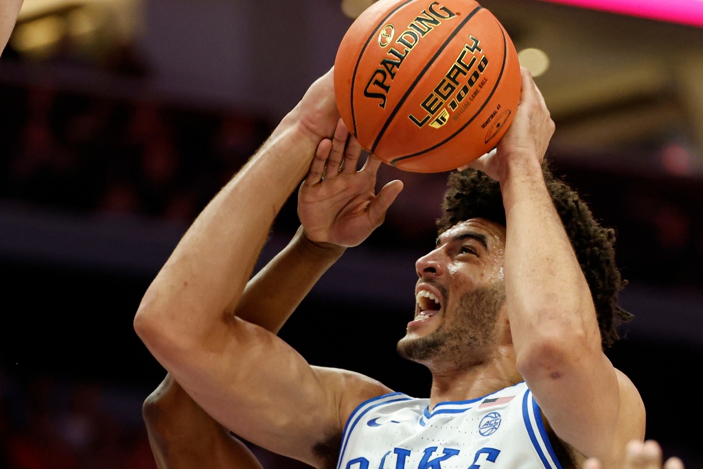 Duke forward Cameron Boozer drives to the basket against Clemson during the first half of an NCAA college basketball game in the semifinals of the Atlantic Coast Conference tournament in Charlotte, N.C., Friday, March 13, 2026. (AP Photo/Nell Redmond)