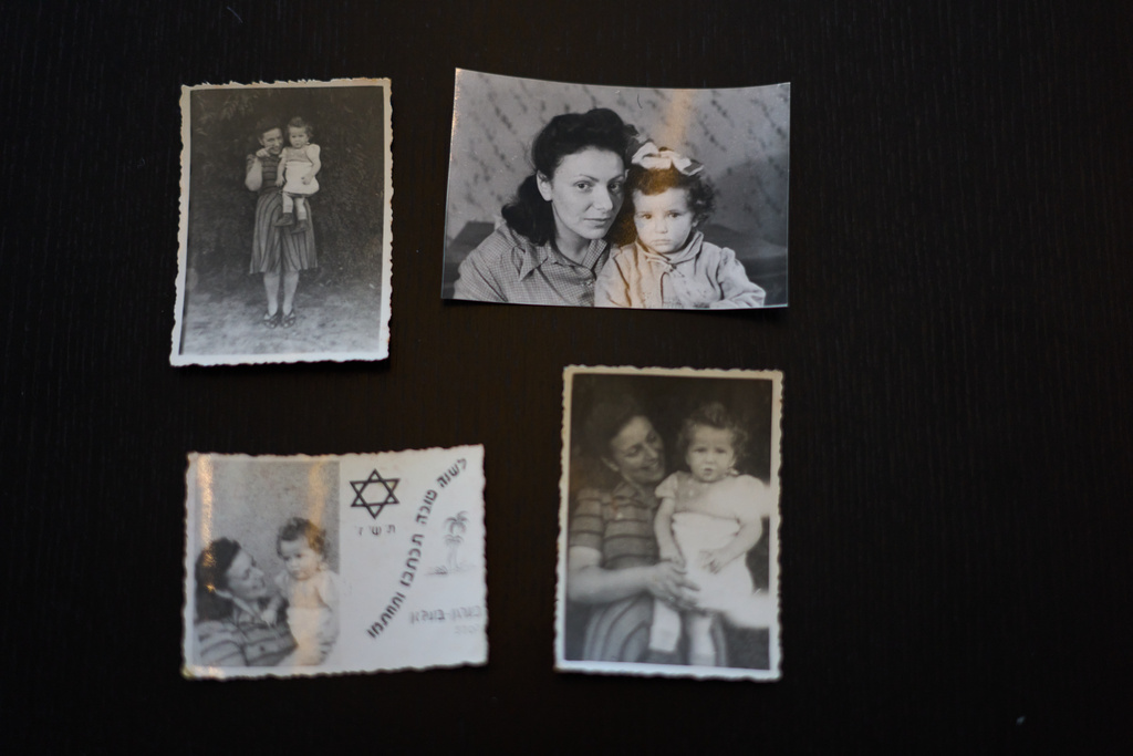 Photos of Holocaust survivor Ilana Kantorowicz Shalem born in the Nazi Bergen-Belsen concentration camp with her with mother Lola in the camp in 1946, in Tel Aviv, Israel, Jan. 26, 2026. (AP Photo/Ariel Schalit)
