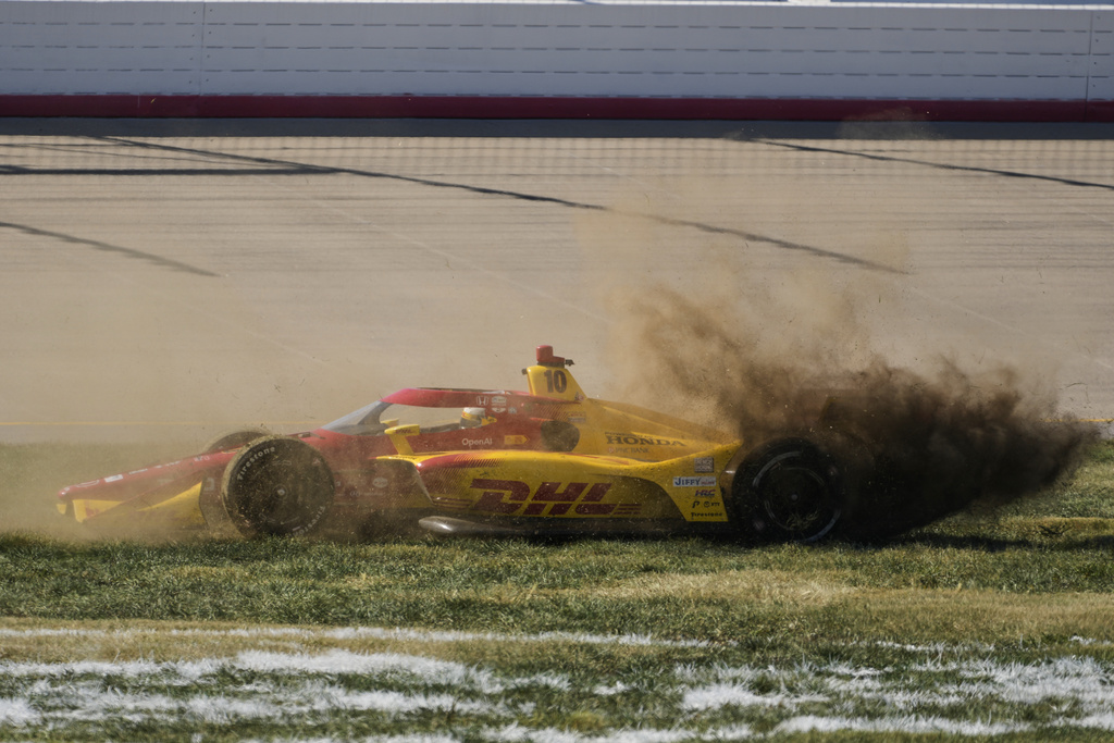 Alex Palou (10) celebrates after winning the IndyCar championship Sunday, Aug. 31, 2025, at Nashville Superspeedway in Lebanon, Tenn. (AP Photo/George Walker IV)