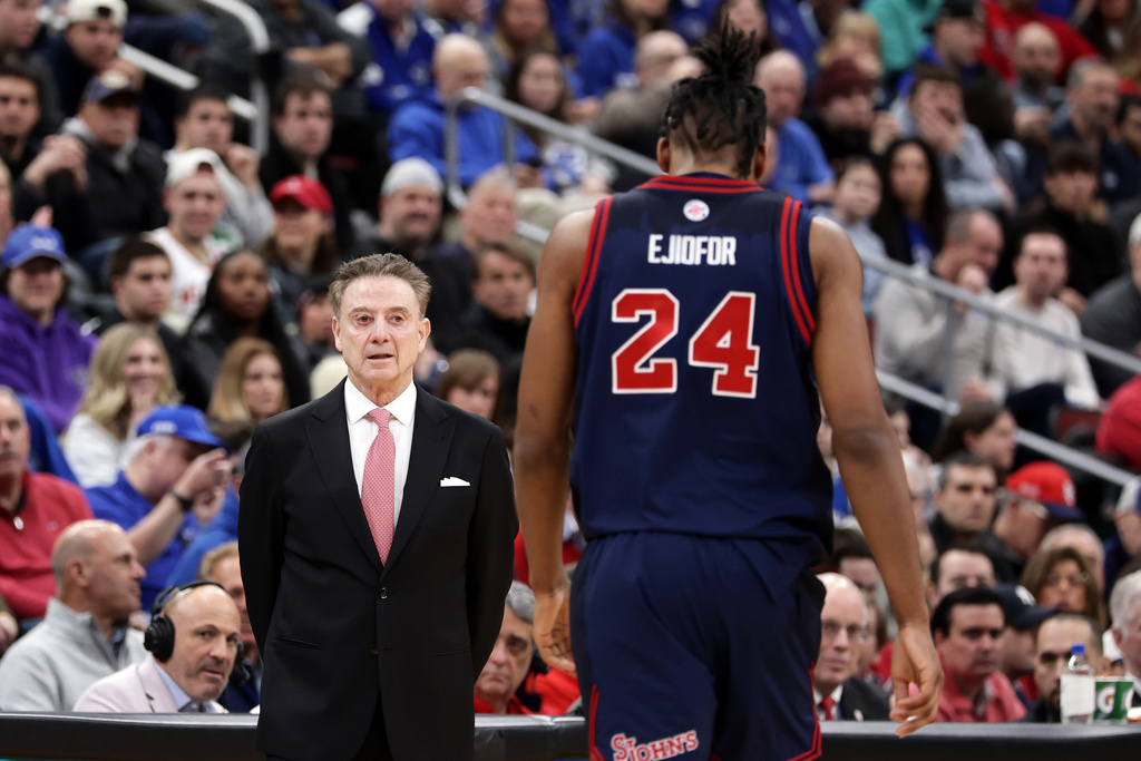 St. John's head coach Rick Pitino talks to Zuby Ejiofor during the first half of an NCAA college basketball game against Seton Hall, Friday, March 6, 2026, in Newark, N.J. (AP Photo/Adam Hunger)