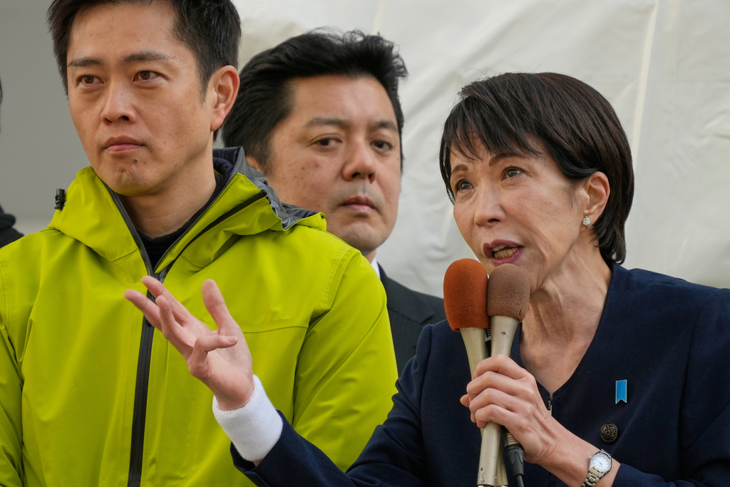 FILE - Sanae Takaichi, right, of the ruling Liberal Democratic Party, and Japan Innovation Party leader Hirofumi Yoshimura, left, hold a joint campaign rally in Tokyo, Jan. 27, 2026, as campaigning for the House of Representatives election begins. (AP Photo/Eugene Hoshiko, File)