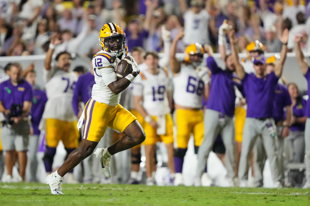 LSU wide receiver Kyle Parker (12) carries for a touchdown against South Carolina in the second half of an NCAA college football game, Saturday, Oct. 11, 2025 in Baton Rouge, La. (AP Photo/Gerald Herbert)