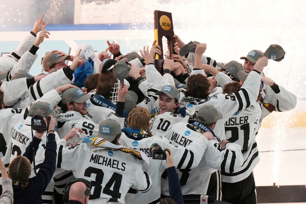 FILE - Members of Western Michigan celebrate after defeating Boston University in the championship game of the NCAA Frozen Four men's college hockey tournament, Saturday, April 12, 2025, in St. Louis (AP Photo/Jeff Roberson, File)