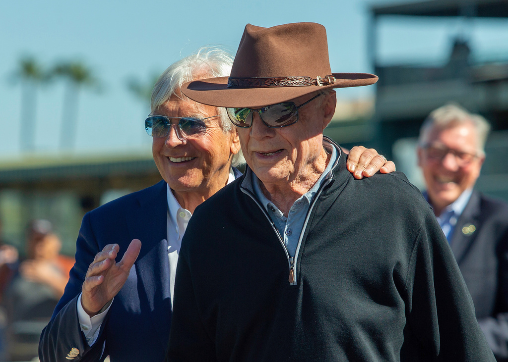 Co-owner David Michael Talla, right, and trainer Bob Baffert savor Splendora 's victory in the Grade I $300,000 B. Wayne Hughes Beholder Mile horse race, Saturday, March 7, 2026 at Santa Anita Park in Arcadia, Calif. (Benoit Photo via AP)