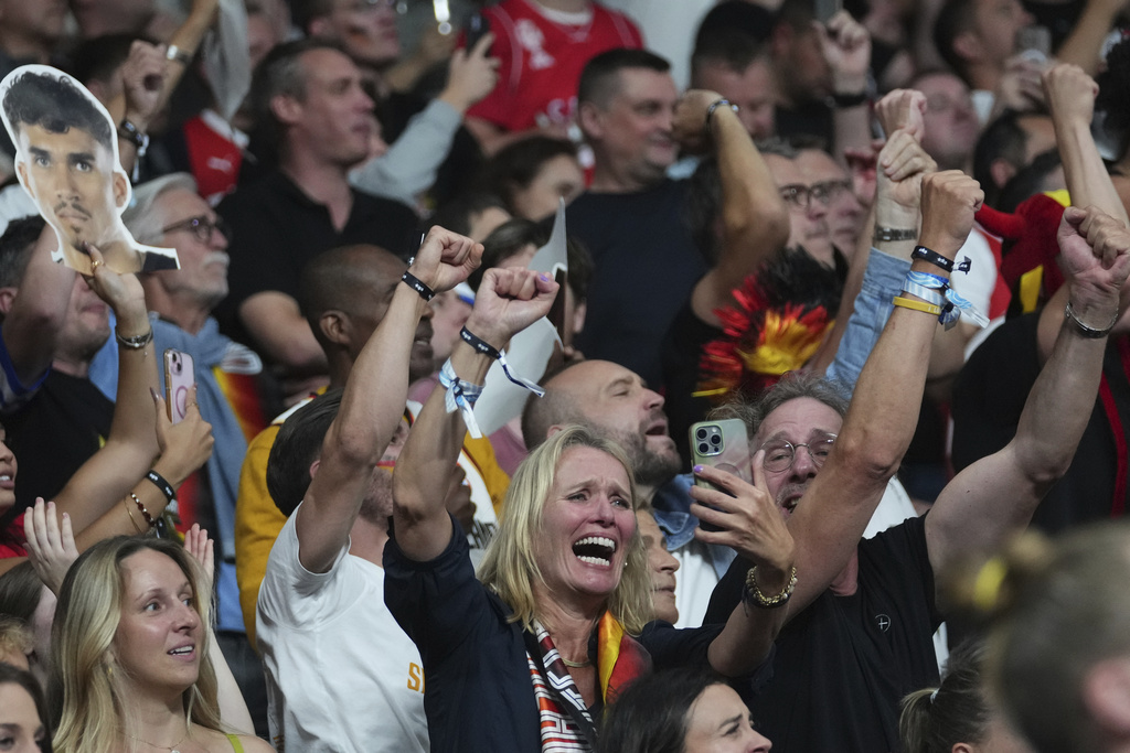 Germany fans cheer during the Eurobasket, European Basketball Championship final match between Turkey and Germany at the Riga Arena in Riga, Latvia, Sunday, Sept. 14, 2025. (AP Photo/Sergei Grits)