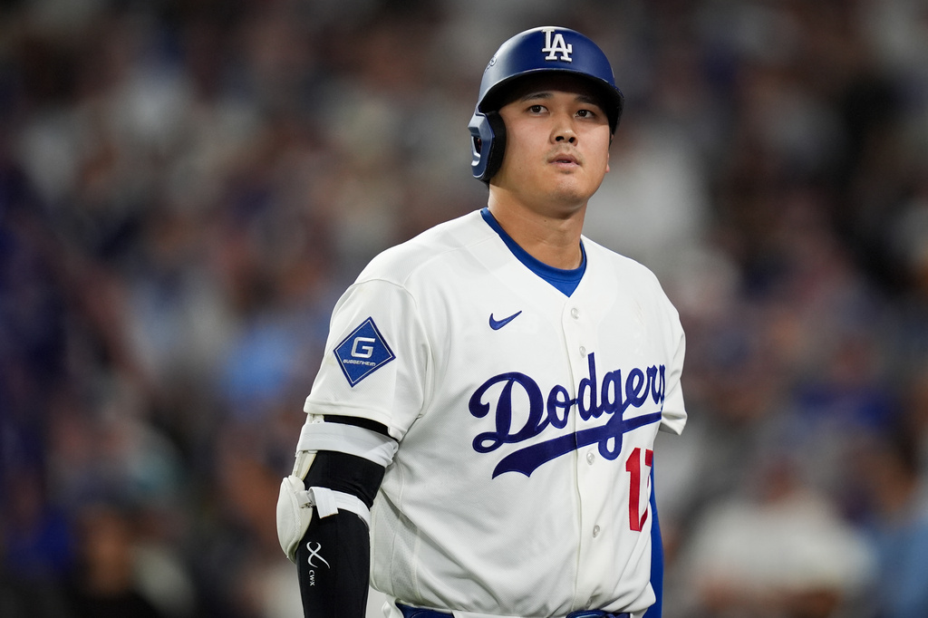 Los Angeles Dodgers designated hitter Shohei Ohtani walks to the dugout after striking out during the seventh inning of Game 4 of baseball's National League Championship Series between the Milwaukee Brewers and the Los Angeles Dodgers, Thursday, Oct. 15, 2026, in Los Angeles. (AP Photo/Gregory Bull)