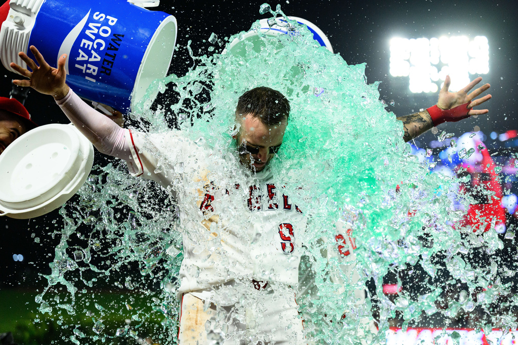 Los Angeles Angels' Zach Neto is douced after hitting a walkoff home run during the ninth inning of a baseball game against the Athletics, Monday, May 18, 2026, in Anaheim, Calif. (AP Photo/William Liang)