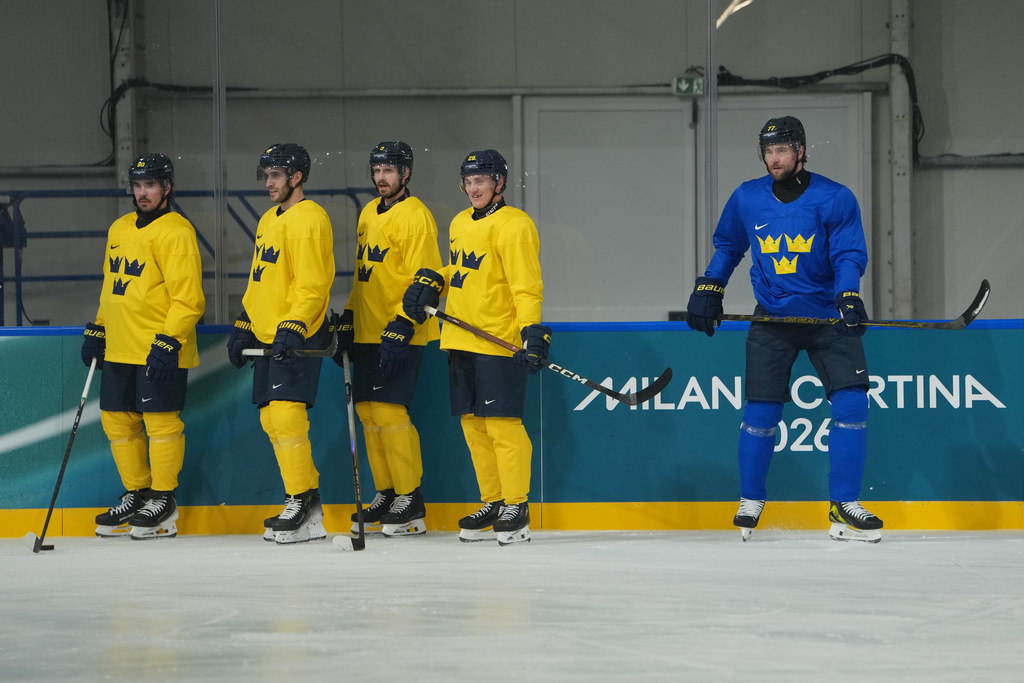From left, Sweden's Marcus Johansson, Alexander Wennberg, Oliver Ekman-Larsson, Pontus Holmberg, and Victor Hedman stand on the ice during men's ice hockey practice at the 2026 Winter Olympics, in Milan, Italy, Sunday, Feb. 8, 2026. (AP Photo/Carolyn Kaster)