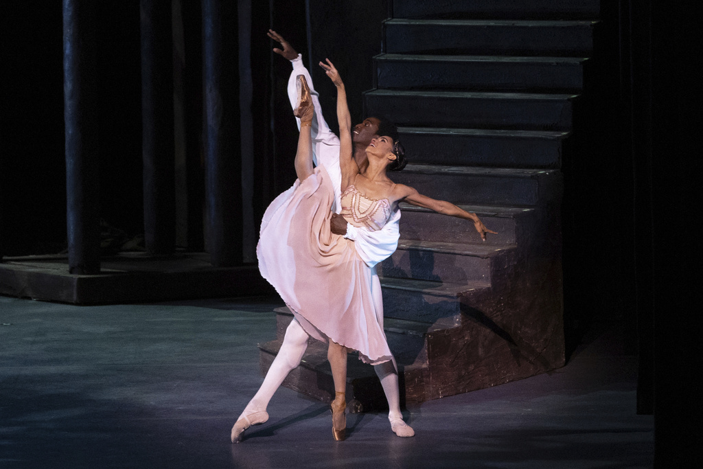 Misty Copeland, right, and Calvin Royal III perform in a duet from "Romeo and Juliet" at Copeland's retirement performance from American Ballet Theatre at the David H. Koch Theater at Lincoln Center on Wednesday, Oct. 22, 2025, in New York. (Rosalie O'Connor via AP)