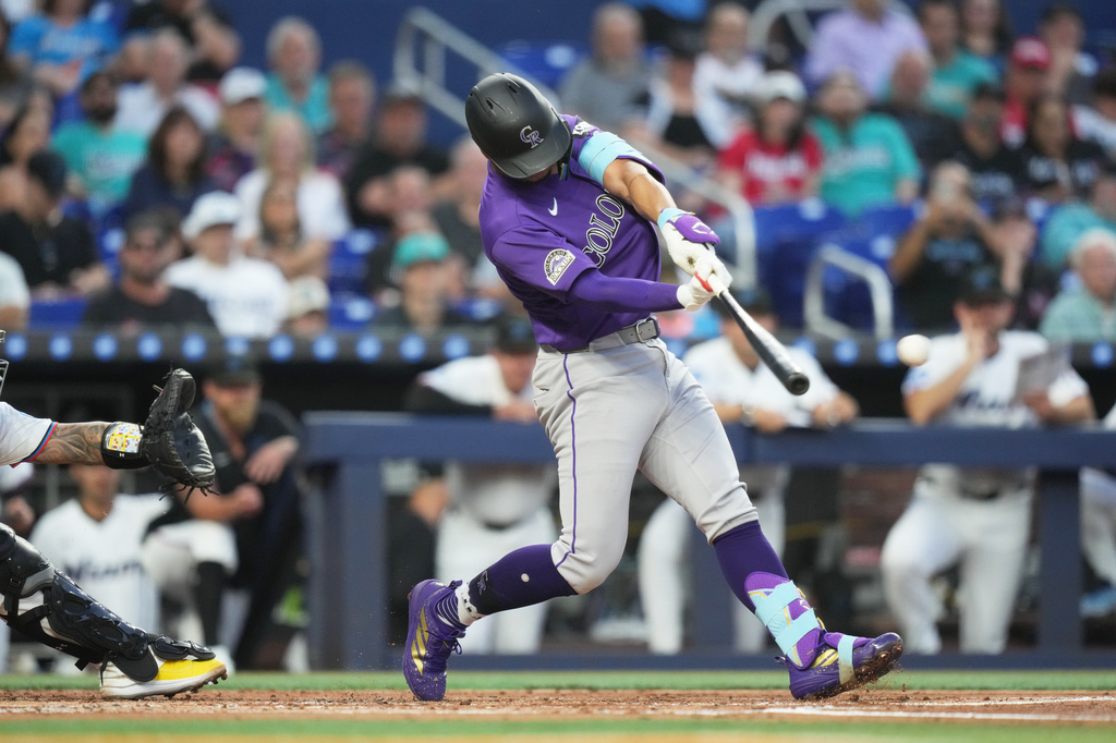 Colorado Rockies' Ezequiel Tovar hits a singe during the second inning of a baseball game against the Miami Marlins, Friday, March 27, 2026, in Miami. (AP Photo/Lynne Sladky)