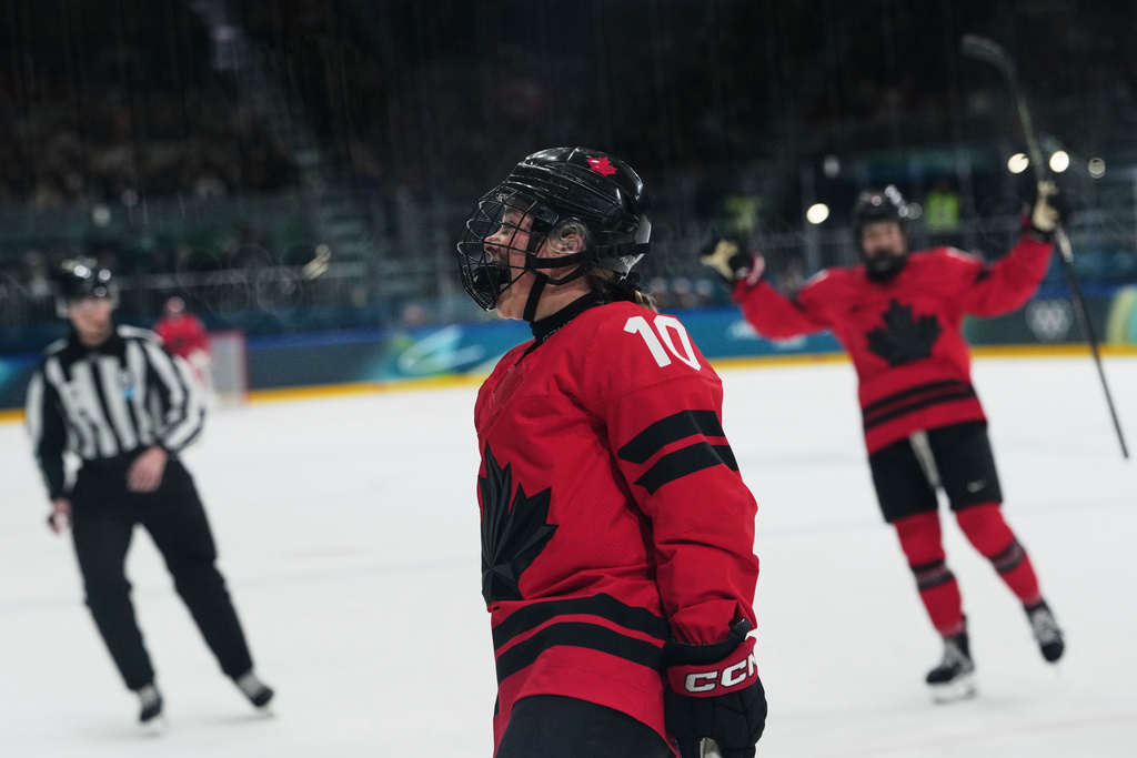 Canada's Sarah Fillier (10) reacts after scoring a goal in the first period against Czechia during a preliminary round match of women's ice hockey at the 2026 Winter Olympics, in Milan, Italy, Monday, Feb. 9, 2026. (AP Photo/Carolyn Kaster)
