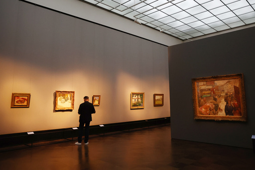 A visitor looks at a paintings with Pierre Bonnard's "Place Clichy" on the right, during a press preview of the exhibition "The Scharf Collection: Goya – Monet – Cezanne – Bonnard – Grosse" at the Alte Nationalgalerie museum in Berlin, Wednesday, Oct. 22, 2025. (AP Photo/Maryam Majd) A visitor looks at a paintings with Pierre Bonnard's "Place Clichy" on the right, during a press preview of the exhibition "The Scharf Collection: Goya – Monet – Cezanne – Bonnard – Grosse" at the Alte Nationalgalerie museum in Berlin, Wednesday, Oct. 22, 2025. (AP Photo/Maryam Majd)