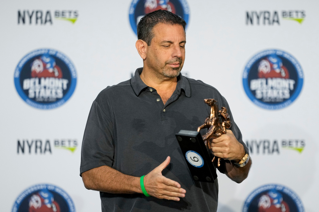 FILE - Co-owner Mike Repole randomly selects sixth position for the entrant Forte during a drawing for post positions ahead of the Belmont Stakes horse race, Tuesday, June 6, 2023, at Belmont Park in Elmont, N.Y. (AP Photo/John Minchillo,File)