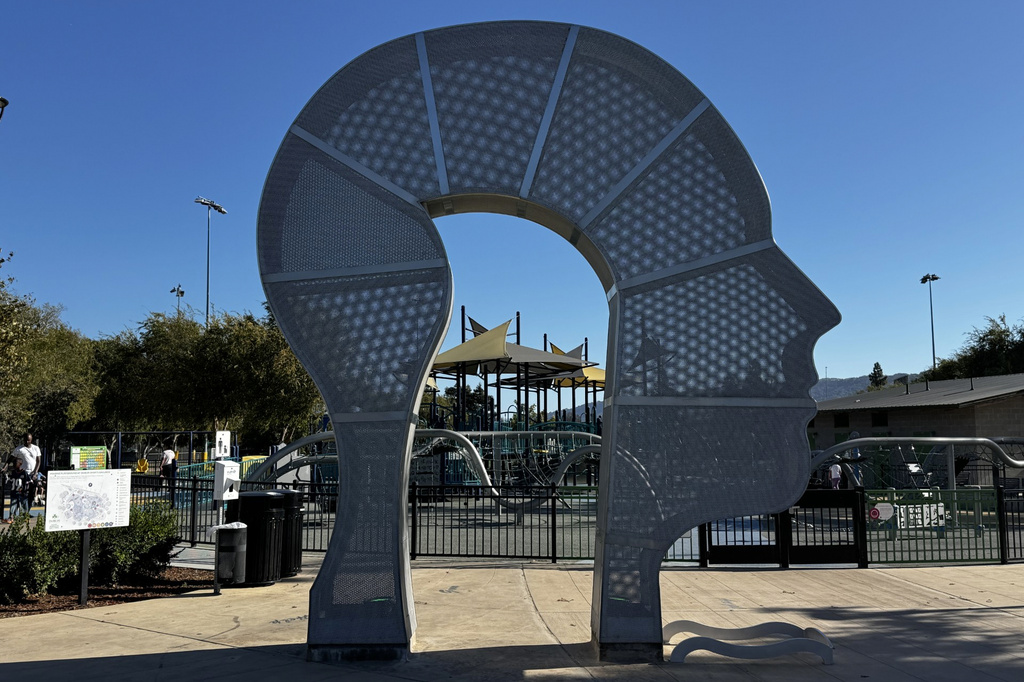 This photo taken with a smartphone shows a sculpture and playground at Dublin Sports Grounds in Dublin, Calif., Monday, Sept. 28, 2026. (AP Photo/Terry Chea)