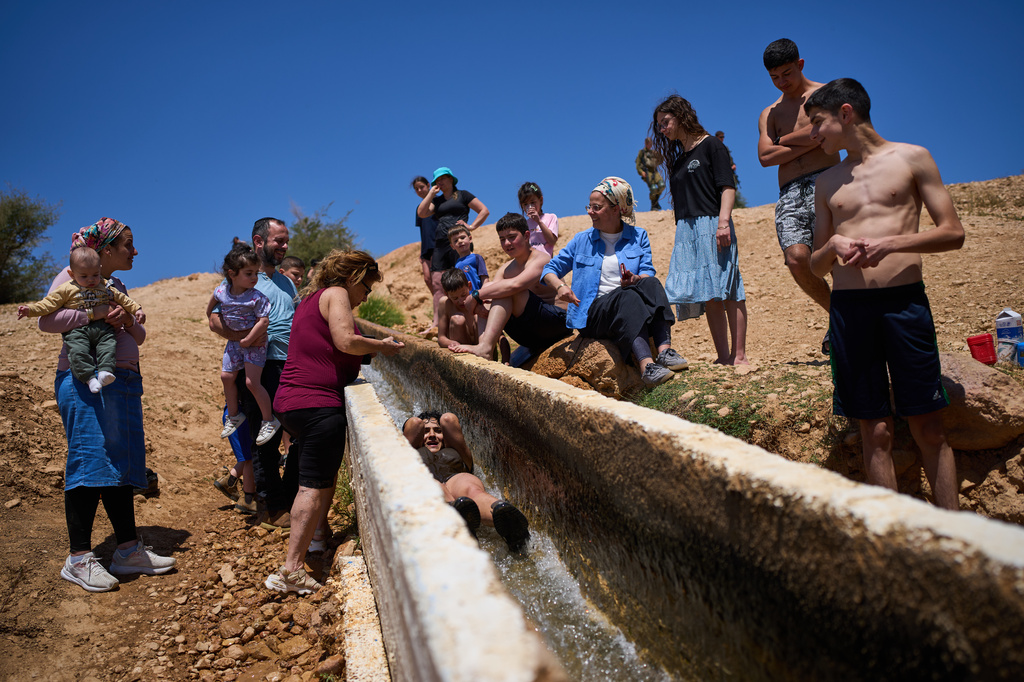 Israelis enjoy a day at a spring in Auja, in the Jordan Valley, during Israel's Independence Day on April 22, 2026, in the occupied West Bank. (AP Photo/Ohad Zwigenberg)