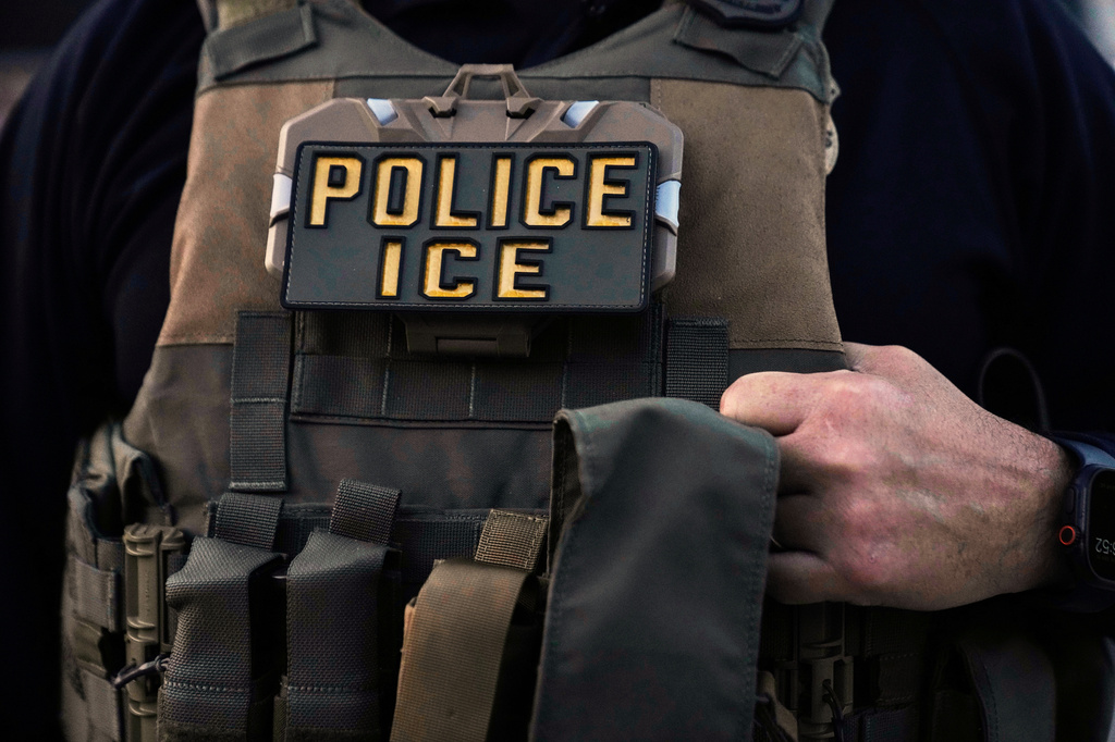 FILE - A U.S. Immigration and Customs Enforcement agent is seen in Park Ridge, Ill., Sept. 19, 2025. (AP Photo/Erin Hooley, File)
