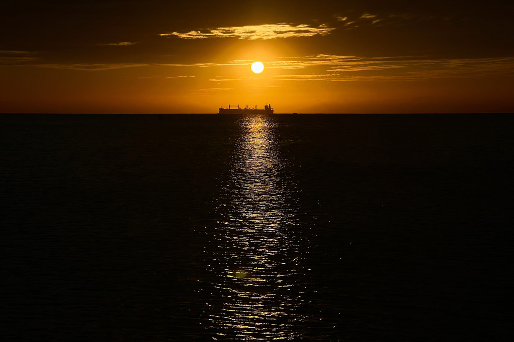 FILE - An oil vessel is visible in the Caribbean Sea at sunset during a nearby conference aimed at transitioning away from fossil fuels April 28, 2026, in Santa Marta, Colombia. (AP Photo/Ivan Valencia, File)