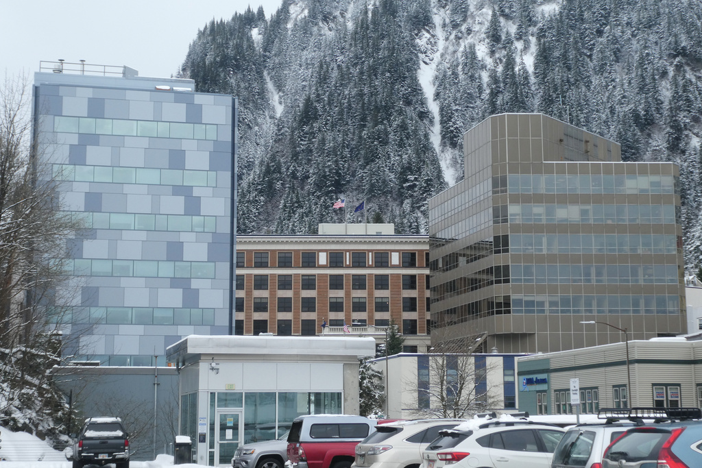 The building housing the director's office of the Alaska Division of Elections, at left, is photographed Thursday, March 19. 2026, in Juneau, Alaska, with the state Capitol and state court building also shown. (AP Photo/Becky Bohrer)