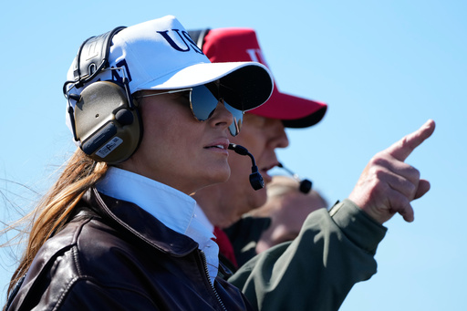 President Donald Trump and first lady Melania Trump watch a naval sea power demonstration, part of the Navy's 250th anniversary celebration, aboard the USS George H.W. Bush aircraft carrier in the Atlantic Ocean off the coast of Norfolk, Va., Sunday, Oct. 5, 2025. (AP Photo/Alex Brandon) President Donald Trump and first lady Melania Trump watch a naval sea power demonstration, part of the Navy's 250th anniversary celebration, aboard the USS George H.W. Bush aircraft carrier in the Atlantic Ocean off the coast of Norfolk, Va., Sunday, Oct. 5, 2025. (AP Photo/Alex Brandon)