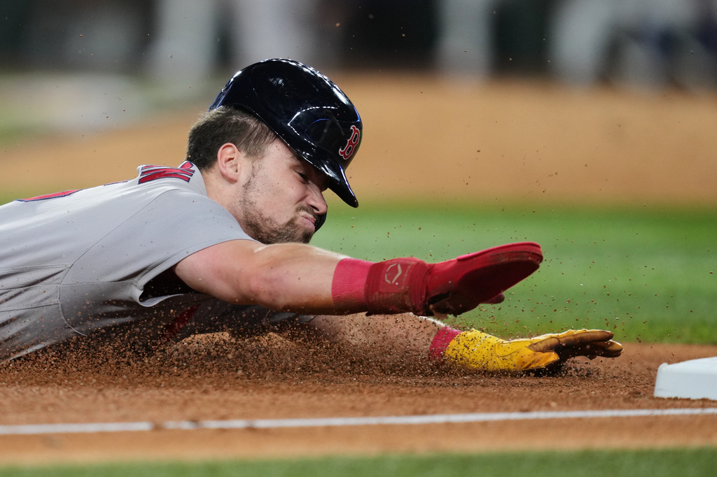 Boston Red Sox's Caleb Durbin advances to third on a single by Trevor Story in the fifth inning of a baseball game against the Texas Rangers Wednesday, Sept. 16, 2026, in Arlington, Texas. (AP Photo/Tony Gutierrez)