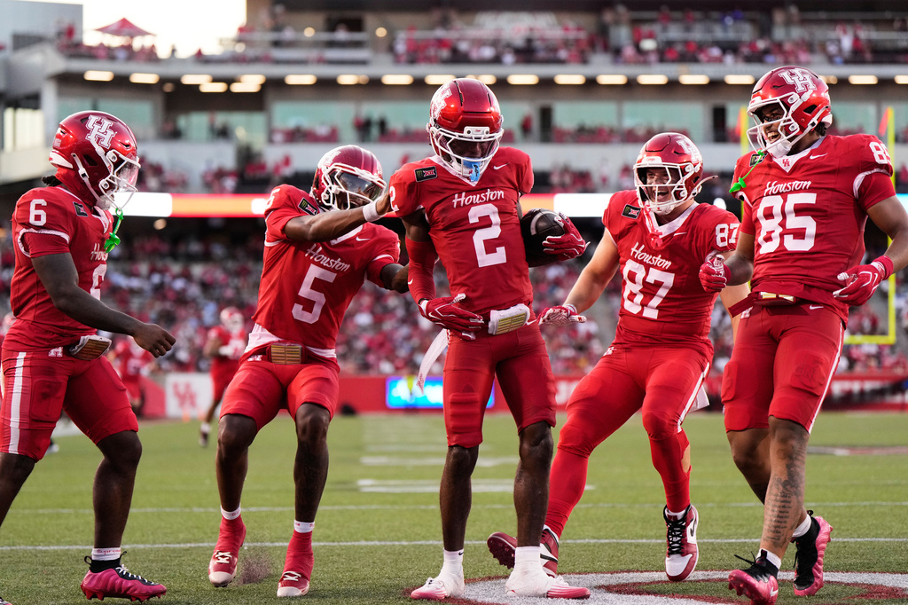 Houston wide receiver Koby Young (2) celebrates with teammates after a touchdown during the first half of an NCAA college football game against Southern in Houston, Saturday, Sept. 12, 2026. (AP Photo/Ashley Landis)