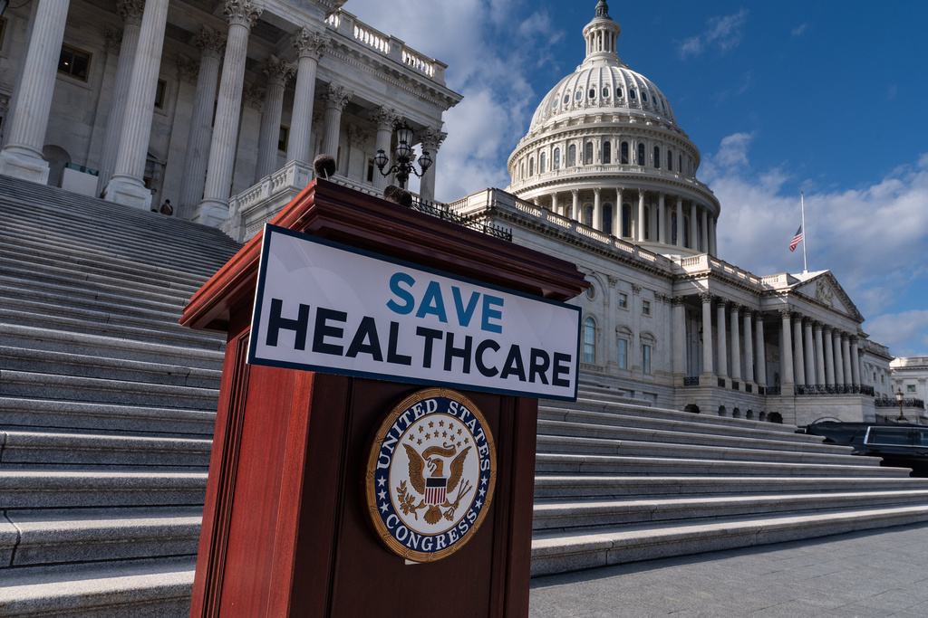 A lectern awaits the arrival of House Democrats to speak on the health care funding fight on the steps of the House before votes to end the government shutdown, at the Capitol in Washington, Wednesday, Nov. 12, 2025. (AP Photo/J. Scott Applewhite)
