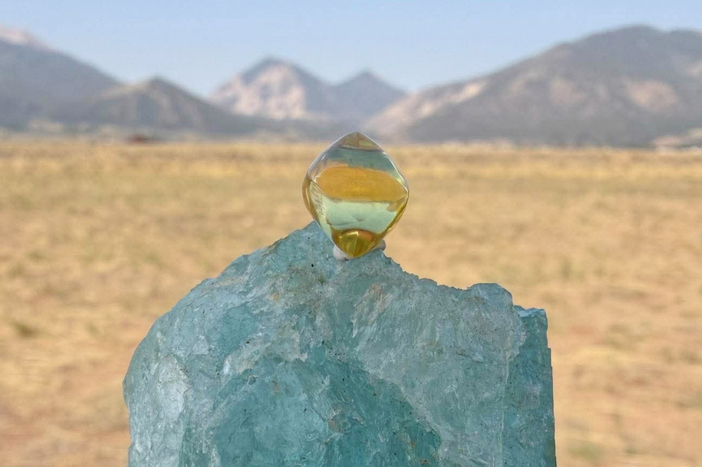 This photo provided by Jack Pearadin shows the American Dream diamond sitting on top of a large gem on Aug. 9, 2026, in Buena Vista, Colo. (Jack Pearadin via AP)