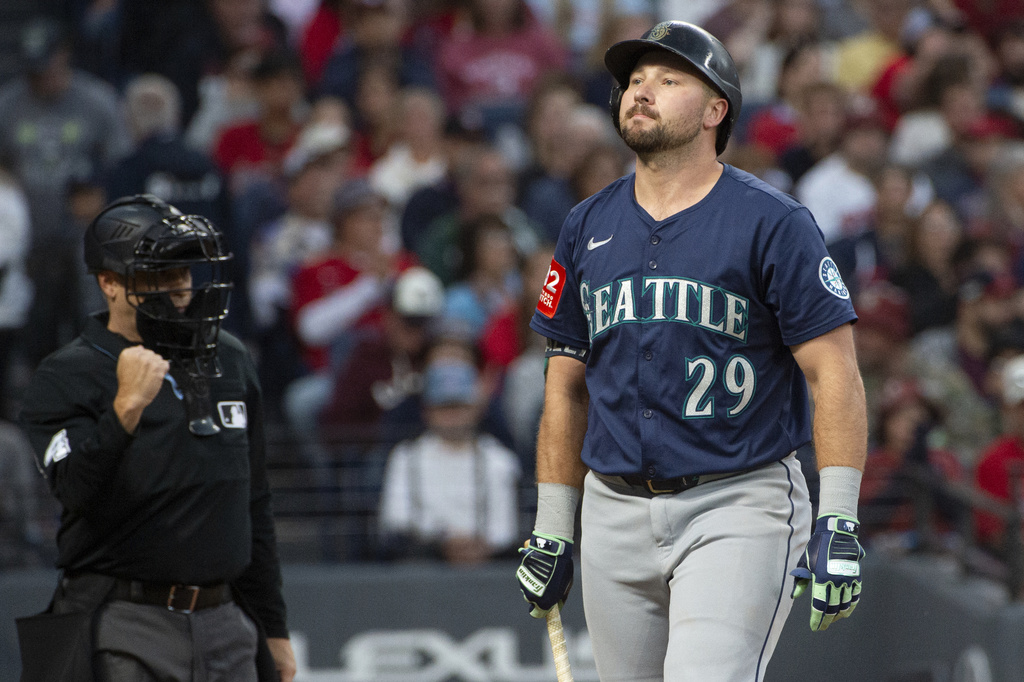 Seattle Mariners' Cal Raleigh reacts after a strike out by Cleveland Guardians starting pitcher Gavin Williams during the third inning of a baseball game, Saturday, Aug. 30, 2025, in Cleveland. (AP Photo/Phil Long)