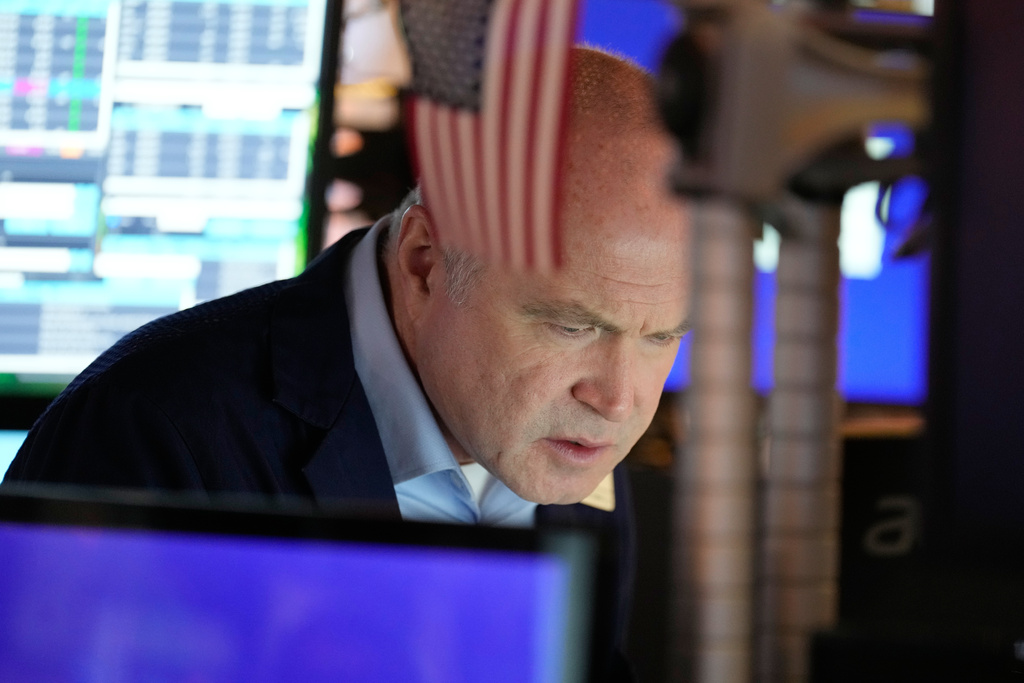 Derek Orth works on the floor at the New York Stock Exchange in New York, Wednesday, Dec. 10, 2025. (AP Photo/Seth Wenig)