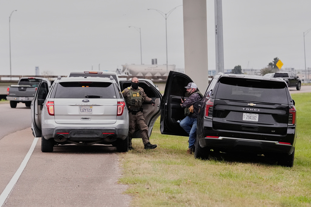 Customs and Border Patrol agents exit their vehicles to question occupants of a vehicle they pulled over, during an immigration crackdown in Kenner, La., Friday, Dec. 5, 2025. (AP Photo/Gerald Herbert, file)