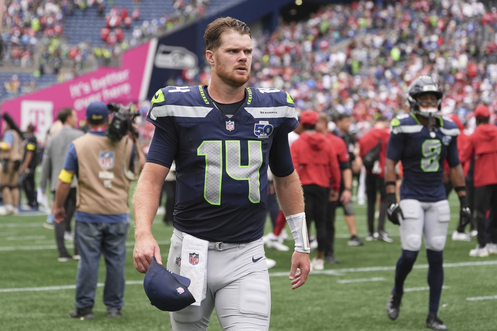 Seattle Seahawks quarterback Sam Darnold (14) walks off the field after an NFL football game against the San Francisco 49ers, Sunday, Sept. 7, 2025, in Seattle. (AP Photo/Lindsey Wasson)