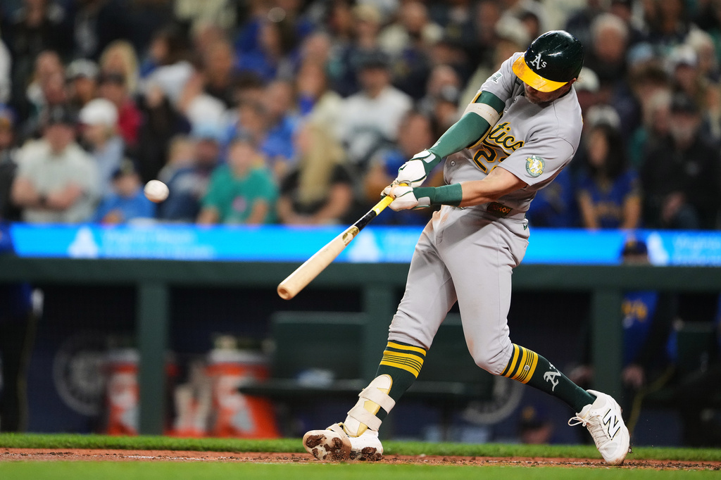 Athletics' Jeff McNeil hits a two-run home run against the Seattle Mariners during the third inning of a baseball game, Friday, Sept. 4, 2026, in Seattle. (AP Photo/Lindsey Wasson)