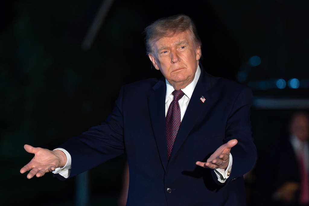 President Donald Trump gestures to reporters as he walks on the South Lawn upon his arrival to the White House, Friday, Oct. 2, 2026, in Washington. (AP Photo/Jose Luis Magana)