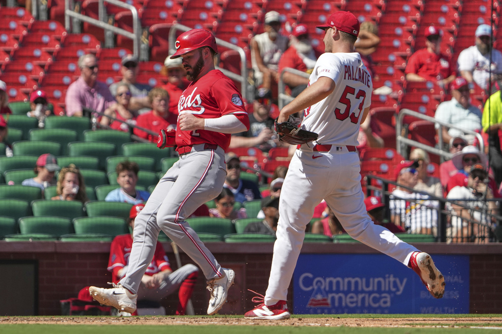 Cincinnati Reds' Gavin Lux, left, scores on a wild pitch by St. Louis Cardinals starting pitcher Andre Pallante (53) during the fifth inning of a baseball gameWednesday, Sept. 17, 2025, in St. Louis. (AP Photo/Jeff Roberson)