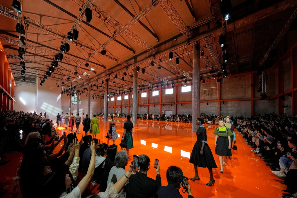 Models wear creations as part of the Prada Spring/Summer 2026 collection presented in Milan, Italy, Thursday, Sept. 25, 2025. (AP Photo/Luca Bruno)