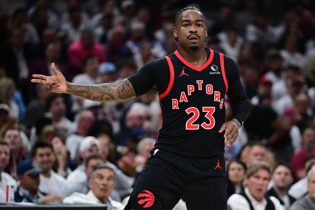 Toronto Raptors guard Jamal Shead reacts after making a three point basket during the first half in Game 5 of a first-round NBA playoffs basketball series against the Cleveland Cavaliers, Wednesday, April 29, 2026, In Cleveland. (AP Photo/David Dermer)