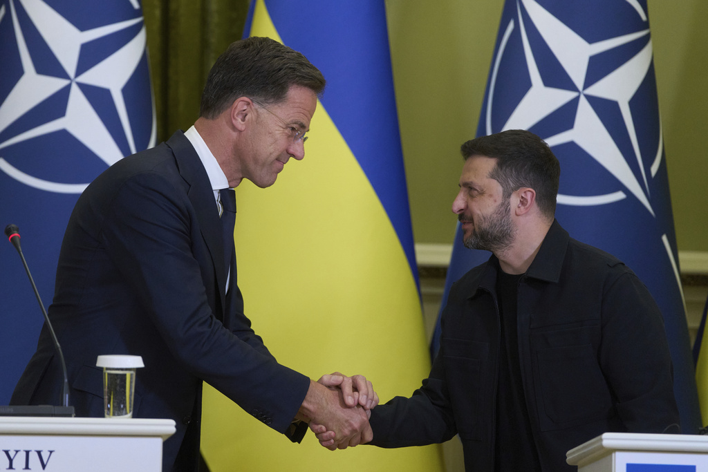 NATO Secretary General Mark Rutte, left, shakes hands with Ukrainian President Volodymyr Zelenskyy during their briefing in Kyiv, Ukraine, Friday, Aug. 22, 2025. (AP Photo/Efrem Lukatsky)