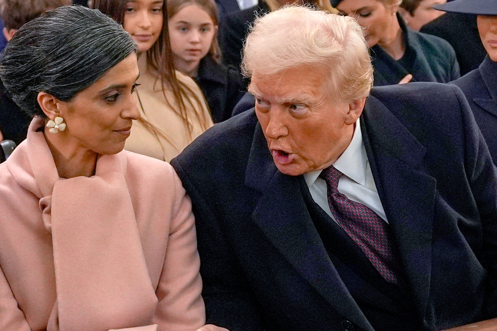 FILE - President-elect Donald Trump, from right, talks with Usha Vance and Vice President-elect JD Vance, not pictured, before a service at St. John's Church, Jan. 20, 2025, in Washington. (AP Photo/Evan Vucci, File)
