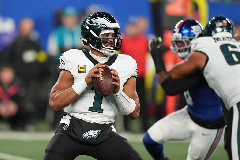 Philadelphia Eagles' Jalen Hurts plays during the first half of an NFL football game against the New York Giants Thursday, Oct. 9, 2025, in East Rutherford, N.J. (AP Photo/Seth Wenig)