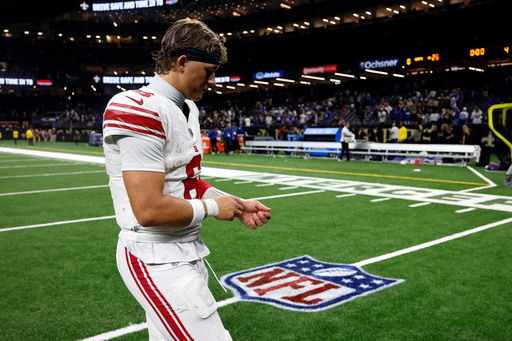 New York Giants quarterback Jaxson Dart walks off the field after a loss to the New Orleans Saints in an NFL football game, Sunday, Oct. 5, 2025, in New Orleans. (AP Photo/Butch Dill) New York Giants quarterback Jaxson Dart walks off the field after a loss to the New Orleans Saints in an NFL football game, Sunday, Oct. 5, 2025, in New Orleans. (AP Photo/Butch Dill)