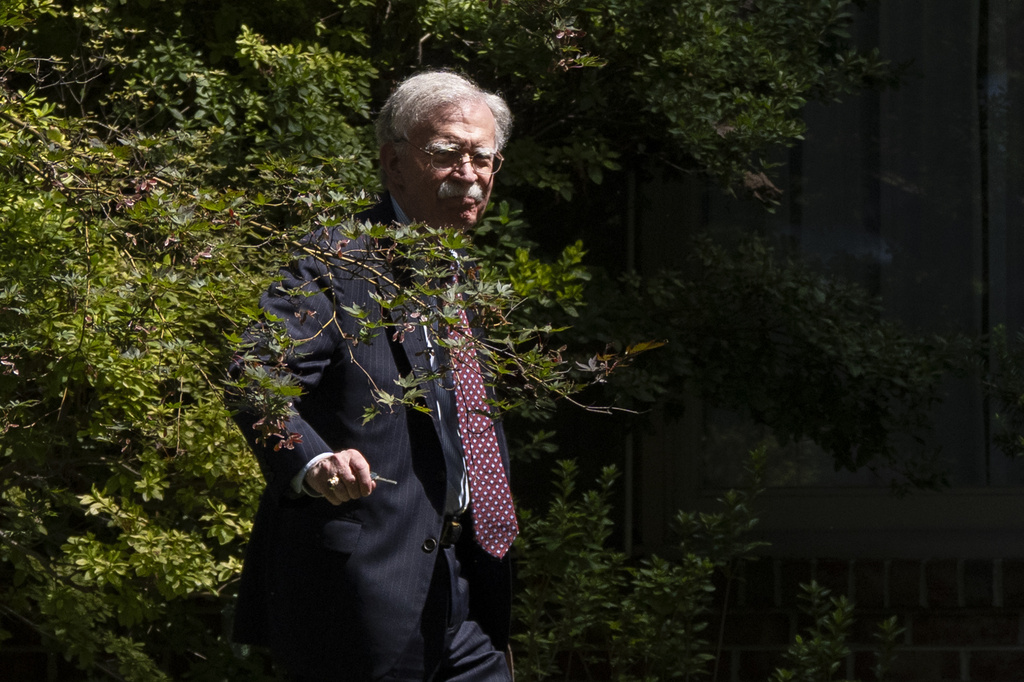 Former national security adviser John Bolton arrives at his house Friday, Aug. 22, 2025, in Bethesda, Md. (AP Photo/Manuel Balce Ceneta)