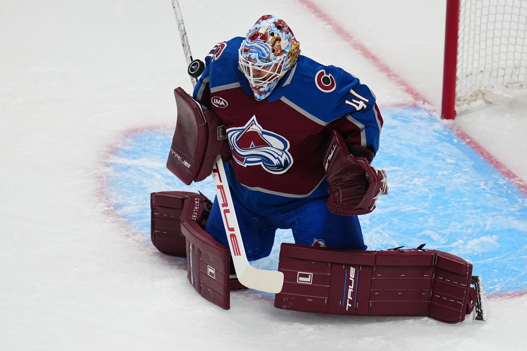 Colorado Avalanche goaltender Scott Wedgewood blocks a shot against the Los Angeles Kings during the first period of Game 1 in the first round of the NHL hockey Stanley Cup playoffs, Sunday, April 19, 2026, in Denver. (AP Photo Jack Dempsey)